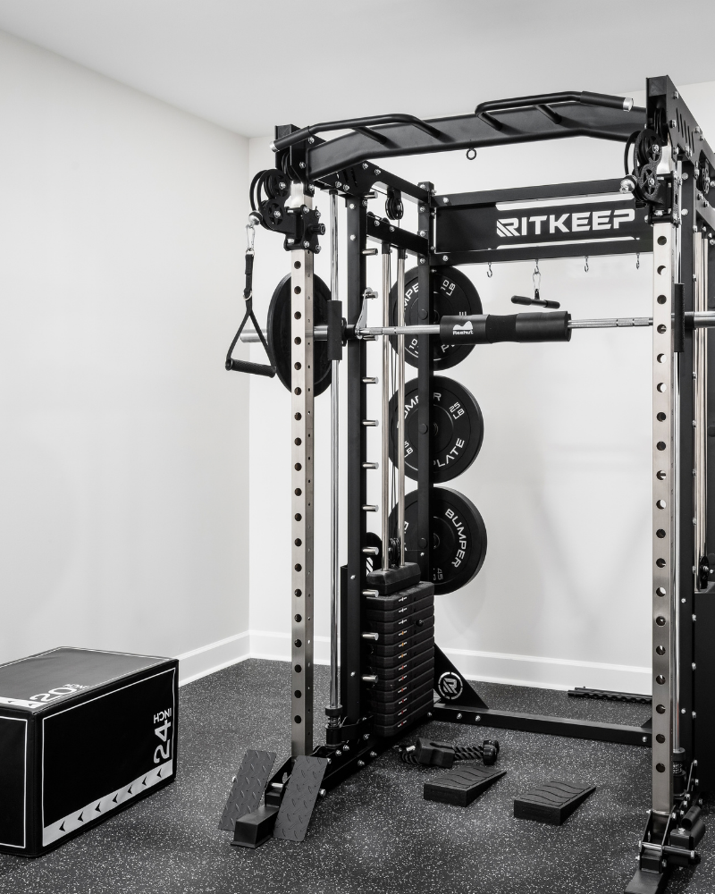 Basement home gym with a functional trainer rack, dumbbell set, and rubber floor in Indian Land, SC Basement home gym with a functional trainer rack, dumbbell set, and rubber floor in Indian Land, SC